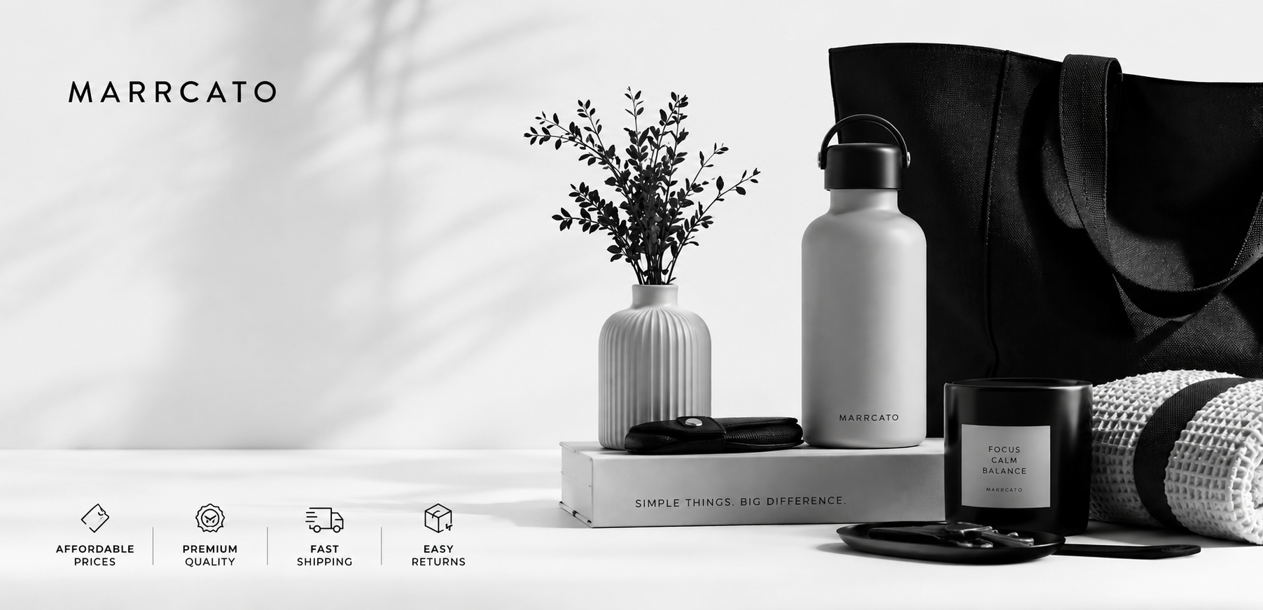 A styled product display featuring a matte white water bottle, a black tote bag, a black candle jar, and a ribbed white vase with dried stems on a light surface. The brand name MARCATO is visible in the upper left, and small feature icons appear along the bottom.